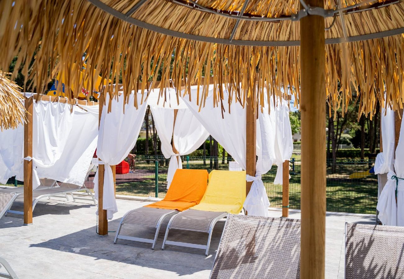 Appartamento a Bibione - Apt. al piano terra + giardino e 1 camera da letto Appartamento a Bibione - Apt. al piano terra + giardino e 1 camera da letto