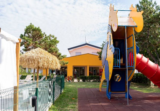 Appartamento a Bibione - Villetta su 2 piani + giardino e 1 camera da letto Appartamento a Bibione - Villetta su 2 piani + giardino e 1 camera da letto