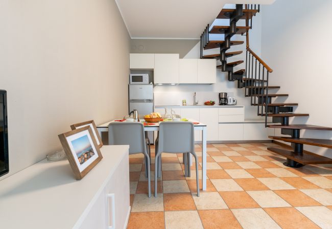 Appartamento a Bibione - Villetta su 2 piani + giardino e 1 camera da letto Appartamento a Bibione - Villetta su 2 piani + giardino e 1 camera da letto